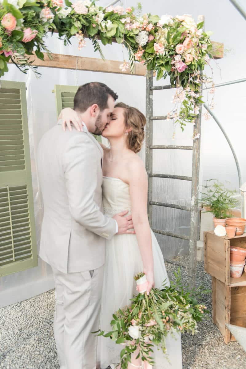 Bride and Groom under trellis